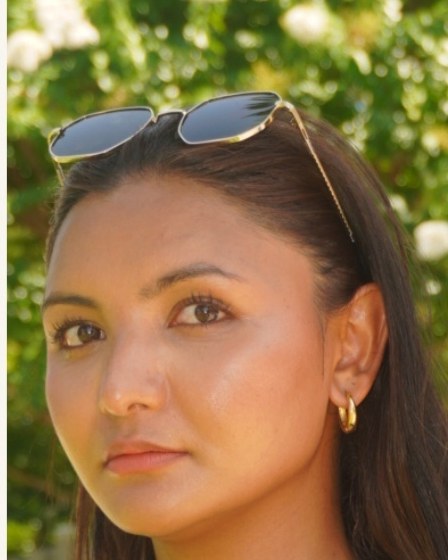 Sriyana C., UGC creator, photographed outdoors in natural light